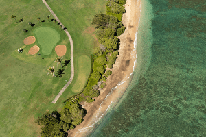 aerial view of the course against the coast